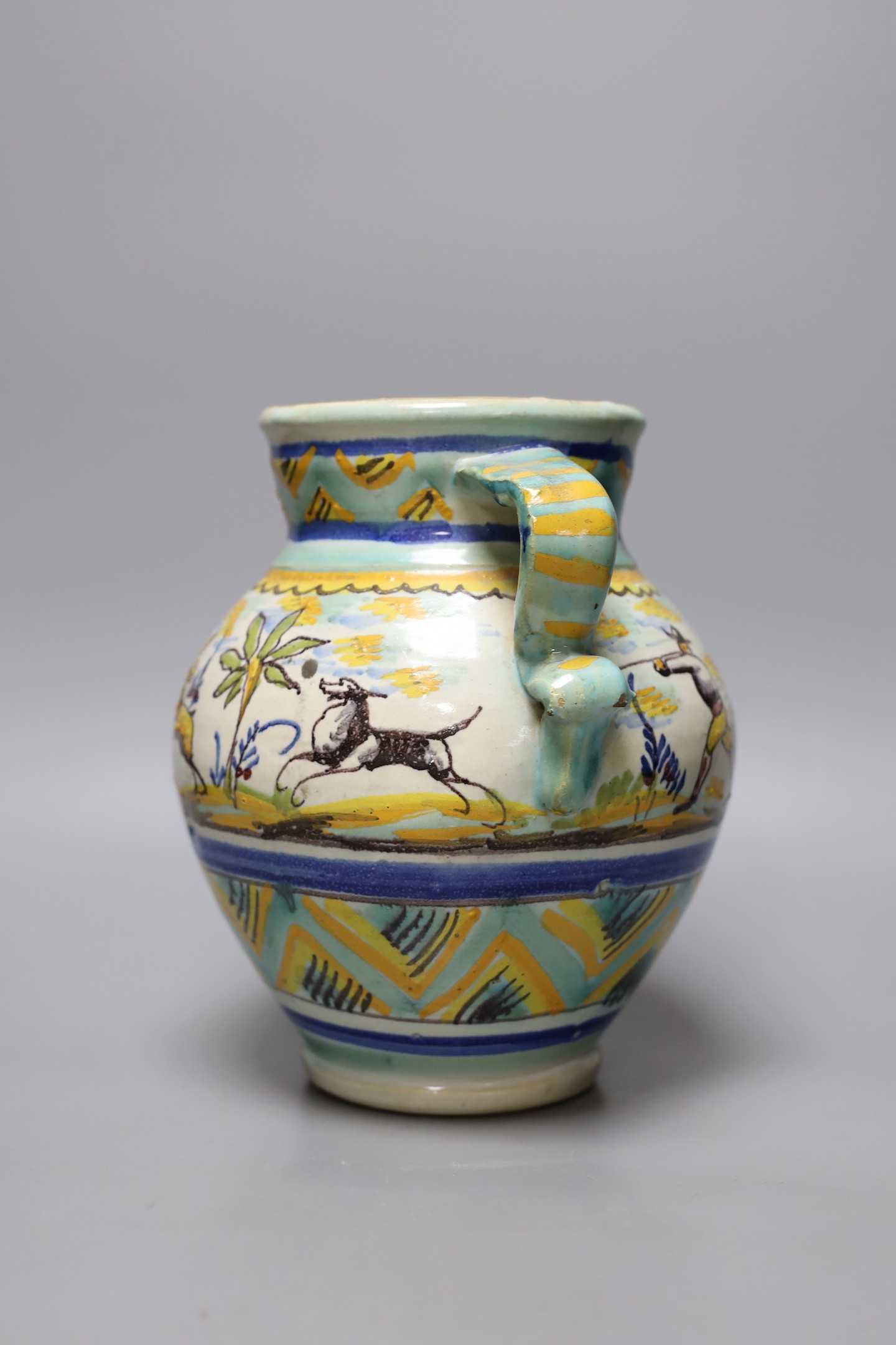 A maiolica vase decorated with hares, 23cm tall